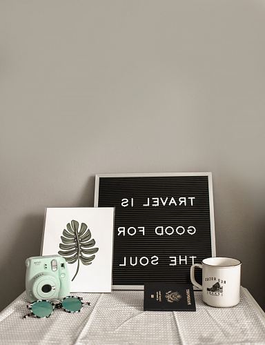 teal Instax Mini 8 instant camera near decor